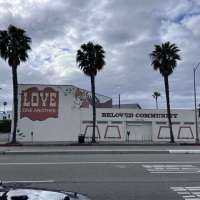 A sign that once said "Guns" now says "Love"